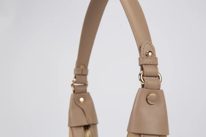 A petite women's handbag with an elegant design - beige